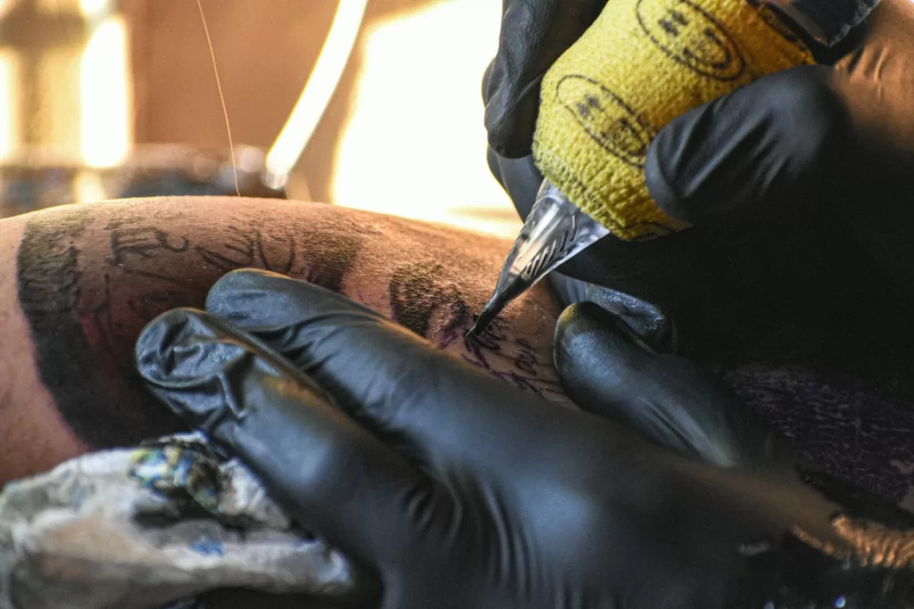 Best Tattoo Inks in India: The Ultimate Artist's Buying Guide A man getting a tattoo on his leg