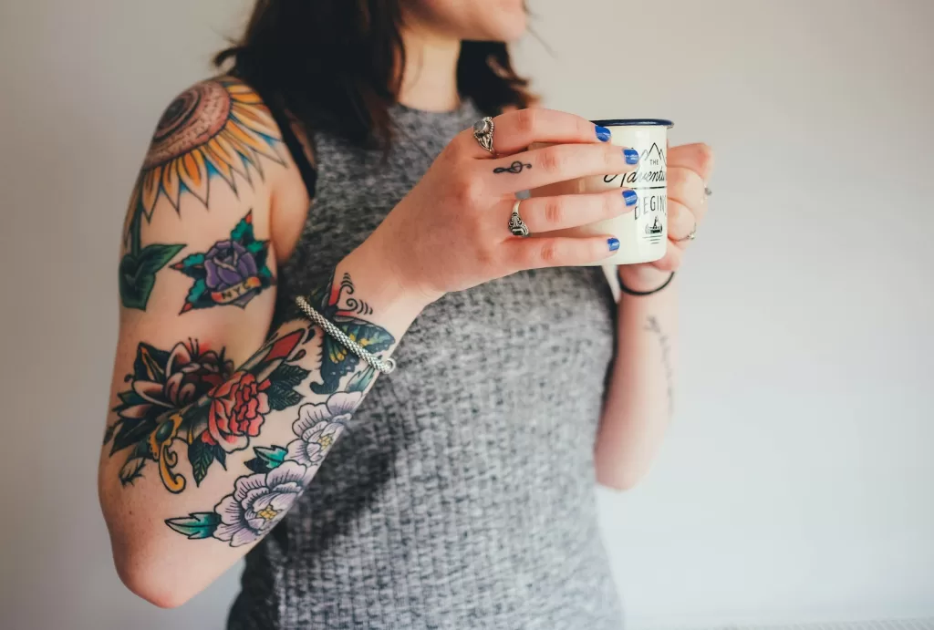 Finding the Best Tattoo Pens in India: A Real Artist's Guide woman holding white ceramic mug