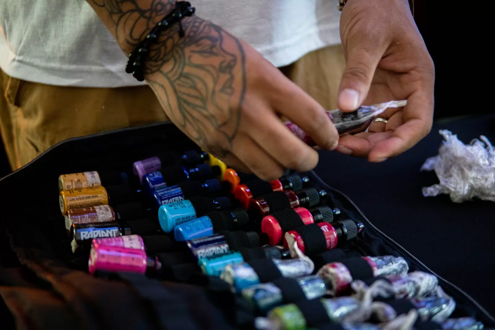 Best Tattoo Inks in India: The Ultimate Artist's Buying Guide a person holding a device