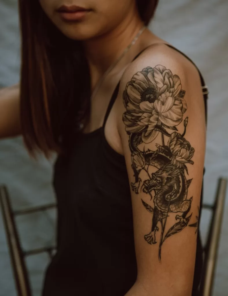 Best Tattoo Kits in India for Beginners Explained woman with black and brown floral tattoo on her back