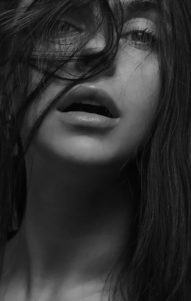 Finding the Best Lip Plumping Device in India: A Buyer's Guide grayscale photography of woman with hair on face