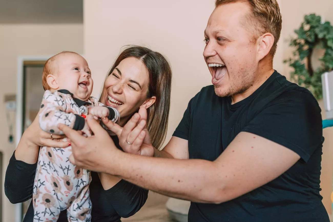 Best Door Bouncer in India: 5 Safe & Sturdy Picks for New Parents Door bouncer free hands - happy parents bonding with their baby at home, the kind of relief a baby door bouncer offers new parents